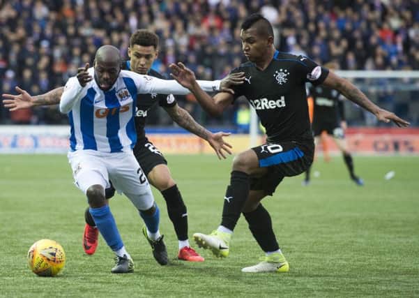 Kilmarnock's Youssouf Mulumbu holds off Alfredo Morelos. Picture: SNS/Alan Harvey