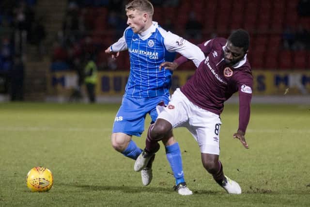 St Johnstone's David Wotherspoon and Hearts' Prince Buaben. Picture: SNS/Kenny Smith