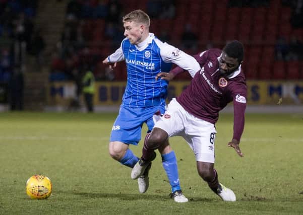 St Johnstone's David Wotherspoon and Hearts' Prince Buaben. Picture: SNS/Kenny Smith