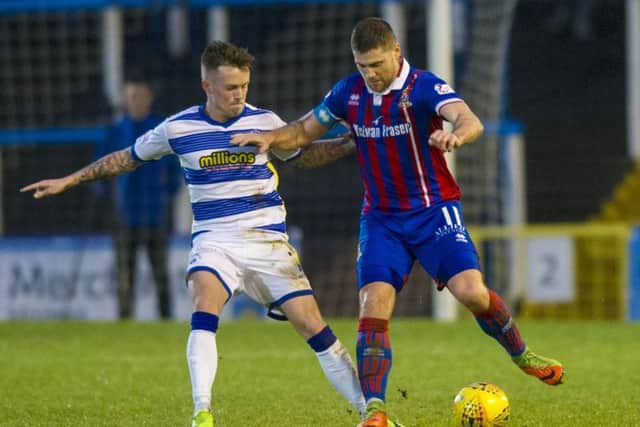 Morton's Gary Oliver in action against Iain Virgus. Picture SNS/Sammy Turner