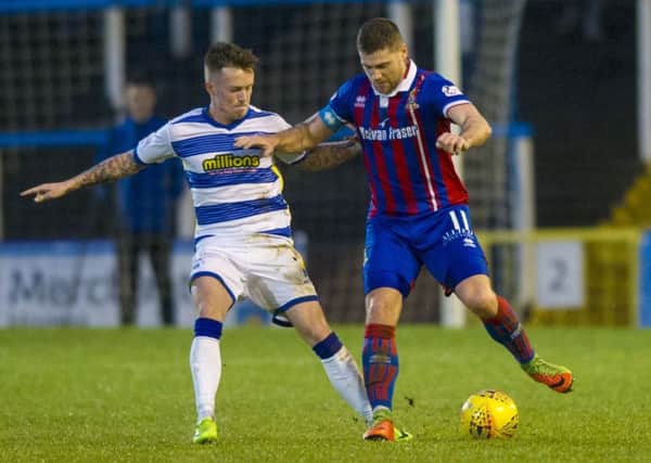 Morton's Gary Oliver in action against Iain Virgus. Picture SNS/Sammy Turner