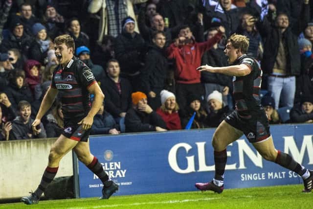 Edinburghs inter-city derby hero Chris Dean, left, races away to celebrate his last-minute try hotly pursued by fellow tryscorer Nathan Fowles. Picture: Gary Hutchison/SNS/SRU