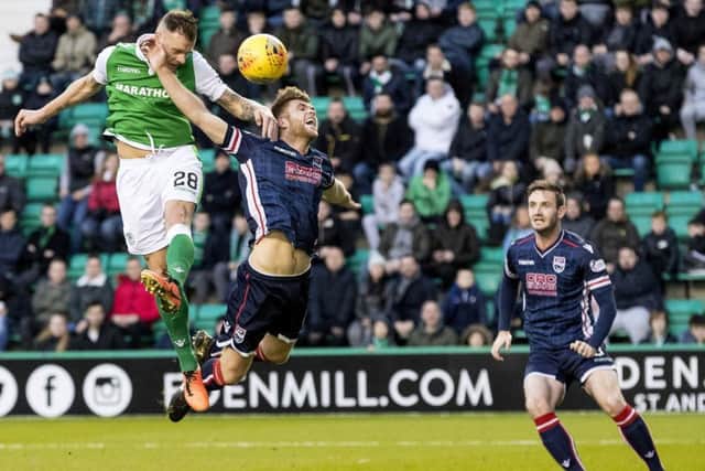 Hibernian's Anthony Stokes leaps highest to score from a header against Ross County. Picture: Alan Rennie