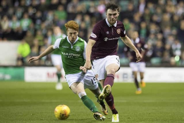 Simon Murray of Hibs attempts to get the ball off Hearts defender John Souttar in the last meeting between these two sides. Picture: SNS Group