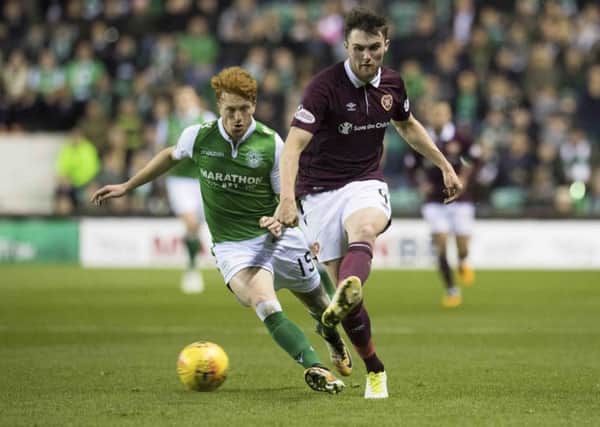 Simon Murray of Hibs attempts to get the ball off Hearts defender John Souttar in the last meeting between these two sides. Picture: SNS Group