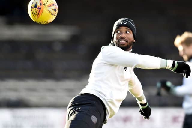 Moussa Dembele takes part in the pre-match warm-up at Dens Park. Picture: SNS Group