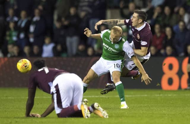 Dylan McGeouch and Jamie Walker tussle in the last derby at Easter Road while Isma watches on. Picture: SNS Group