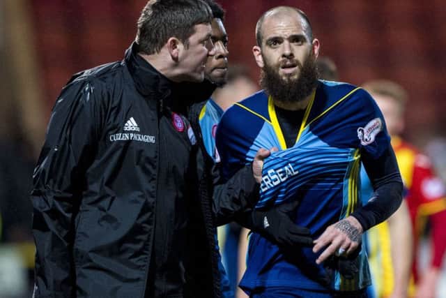 Martin Canning has a word with Georgios Sarris after the defeat to Partick Thistle. Picture: SNS Group