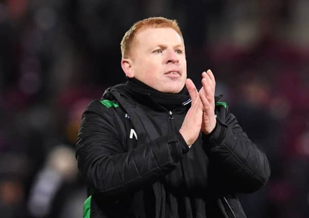 Neil Lennon salutes the Hibs fans at full time but has accused Hearts of trying to kick his players off the park. Picture: SNS Group