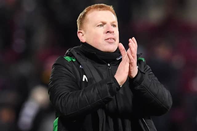 Neil Lennon salutes the Hibs fans at full time but has accused Hearts of trying to kick his players off the park. Picture: SNS Group