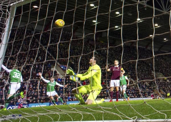 Jon McLaughlin watches on as Oli Shaw (left) sees his flicked effort adjudged not to have crossed the goal-line. Picture: SNS Group