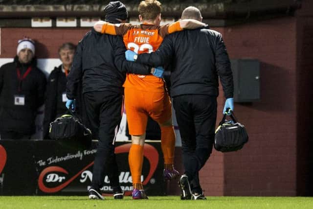 Fraser Fyvie is taken off injured against Livingston. Picture: Bruce White/SNS