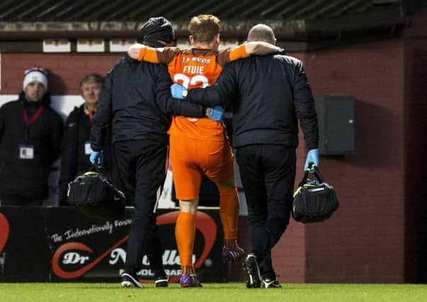 Fraser Fyvie is taken off injured against Livingston. Picture: Bruce White/SNS