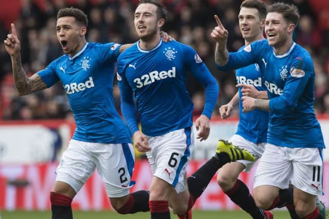Danny Wilson celebrates the opener in Rangers' recent win at Pittodrie with James Tavernier (left) and Josh Windass (right). Picture: Craig Foy/SNS