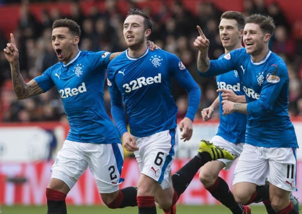 Danny Wilson celebrates the opener in Rangers' recent win at Pittodrie with James Tavernier (left) and Josh Windass (right). Picture: Craig Foy/SNS