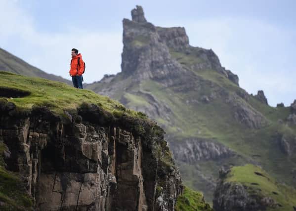Tourist visit the Quiraing on the Isle of Skye (Photo by Jeff J Mitchell/Getty Images)