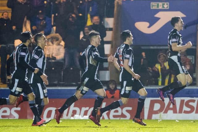 Lewis Morgan, right, celebrates after scoring his and St Mirren's second goal against Dundee United. Picture: SNS
