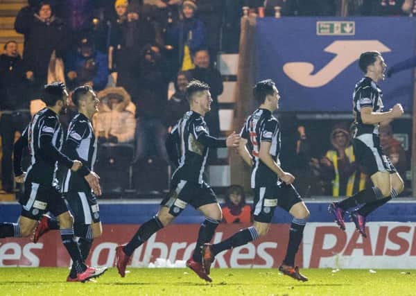 Lewis Morgan, right, celebrates after scoring his and St Mirren's second goal against Dundee United. Picture: SNS