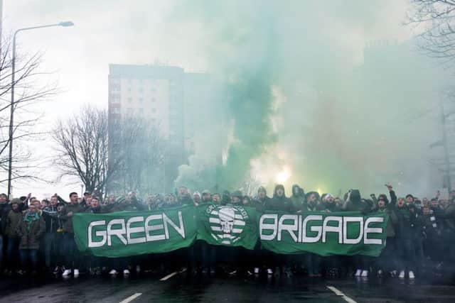 Celtic fans make their way to the stadium before the game. Picture: SNS