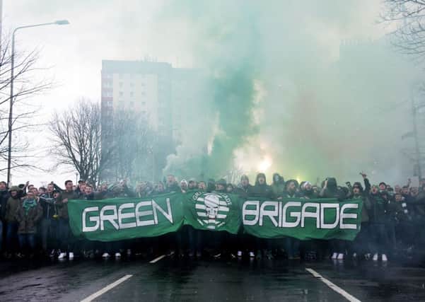 Celtic fans make their way to the stadium before the game. Picture: SNS