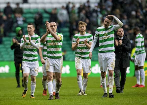 Celtic captain Scott Brown and his team-mates, who now have a week off, applaud the fans after yesterdays Old Firm derby stalemate. Picture: Craig Williamson/SNS