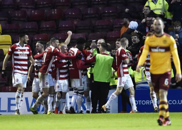 Hamilton players celebrate after Rakish Bingham scores to make it 2-1. Picture: SNS