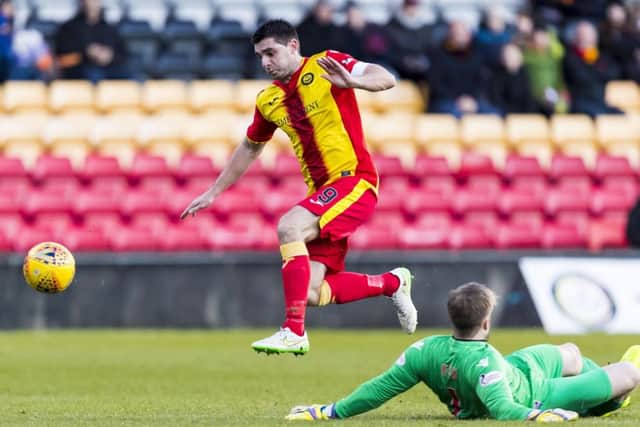 Kris Doolan rounds Scott Fox to make it 1-0 Partick Thistle. Picture: SNS