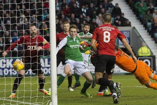 Oli Shaw, centre, flicks home after an error from Kilmarnock's goalkeeper Jamie MacDonald. Picture: SNS