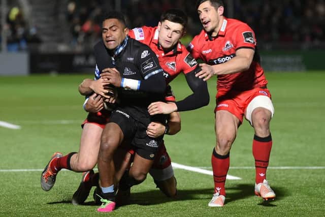 Glasgow Warriors' Niko Matawalu (left) tries to surge forward. Picture: SNS