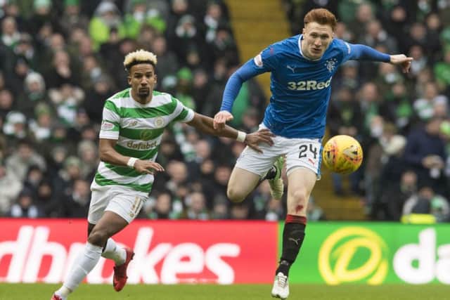 David Bates beats Scott Sinclair to the ball during an impressive performance at Celtic Park. Picture: SNS.