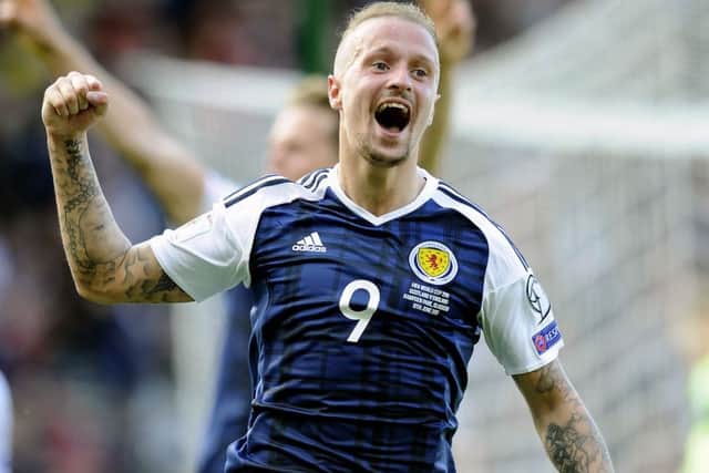 Leigh Griffiths celebrates after scoring the second of his two goals against England. Picture: Michael Gillen