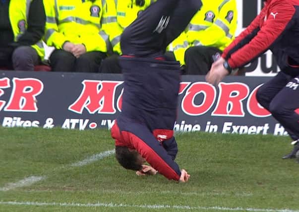Graeme Murty and his famous headstand at Dens Park.