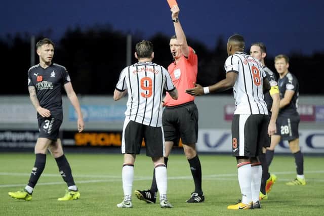 Referee Craig Thomson shows a red card to Dunfermlines Declan McManus during the match against Falkirk on 4 November. Picture: Michael Gillen.