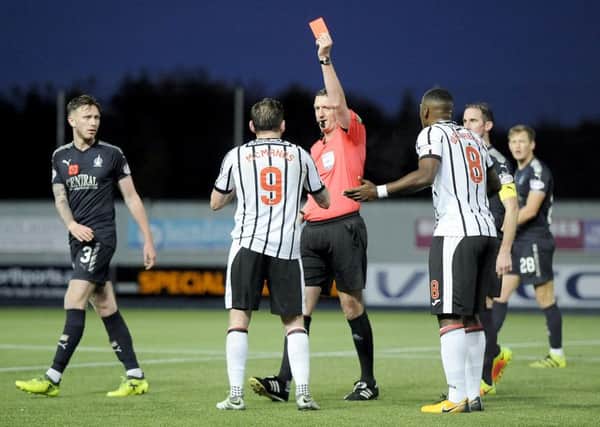 Referee Craig Thomson shows a red card to Dunfermlines Declan McManus during the match against Falkirk on 4 November. Picture: Michael Gillen.