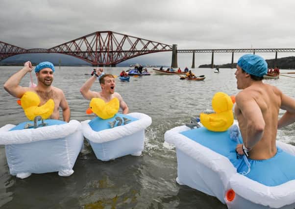 These three Loony Dookers decided to take the idea of going bathing a bit further than most (Picture: Getty)