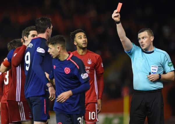 Referee John Beaton shows Kyle Lafferty the red card at Pittodrie. Picture: SNS.