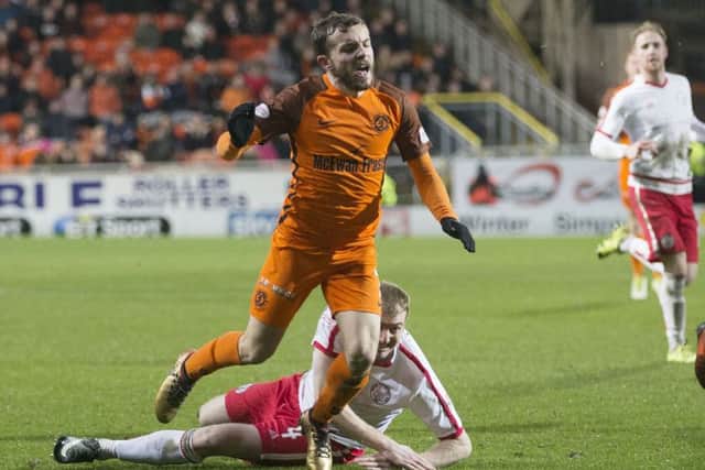 Dundee United's Paul McMullan goes to ground against Brechin. He received a second yellow card for simulation and was sent off. Picture: Kenny Smith/SNS