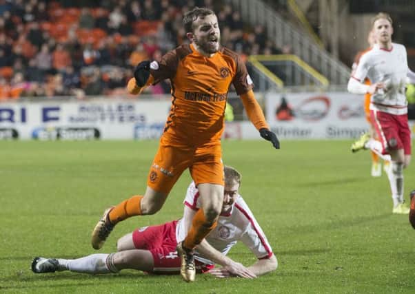 Dundee United's Paul McMullan goes to ground against Brechin. He received a second yellow card for simulation and was sent off. Picture: Kenny Smith/SNS