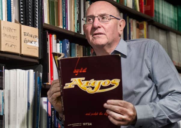 Academic Leigh Sparks, an expert in retail studies, with an Argos catalogue (Picture: John Devlin)