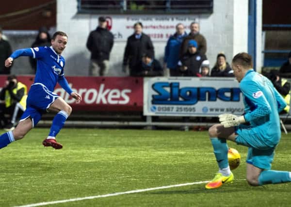 Queen of the South's Chris Kane has a second half shot saved by Dumbarton's Scott Gallacher. Picture: Paul Devlin/SNS