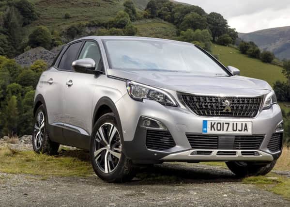 The Peugeot 3008, with flat bonnet line over an extravagant face.