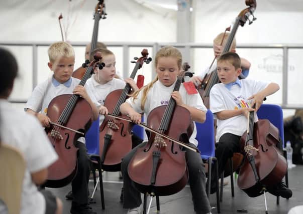 Children from Stirling's Raploch estate perform in a concert organised by Sistema Scotland