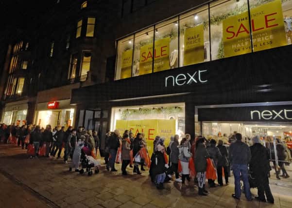 Real shoppers outside a real shop, but many prefer the apparent convenience of online (Picture: Steven Scott Taylor)