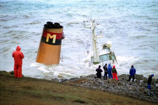 The final moments of the Braer oil tanker as it sinks in Quendale Bay in Shetland after discharging her cargo into the sea and the surrounding Scottish coastline in January 1993. Picture: Allan Milligan/TSPL