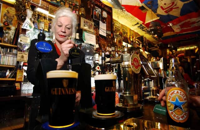 Mary Moriarty, one of the best known landladies in Edinburgh before her retiral in 2009, pours a drink at the Port O Leith bar. Picture: Justin Spittle/TSPL