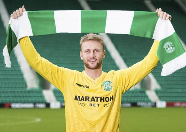 Scott Bain was paraded at Easter Road yesterday after moving to Hibs from Dundee on loan until the end of the season. Picture: SNS.