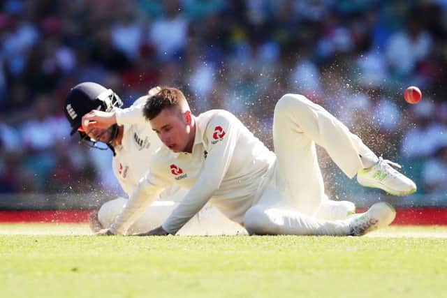 Mason Crane nearly collides with England team-mate Mark Stoneman as he attempts a catch. Picture: Getty.