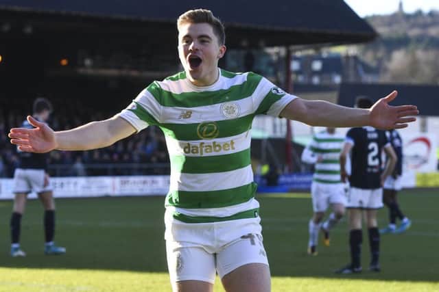 Celtic's James Forrest celebrates his opening goal against Dundee. Picture: SNS