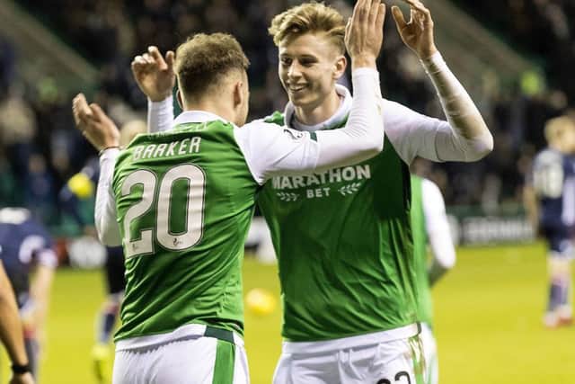 Oli Shaw (right) celebrates Hibs' second goal against Ross County with Brandon Barker. Picture: SNS