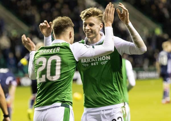 Oli Shaw (right) celebrates Hibs' second goal against Ross County with Brandon Barker. Picture: SNS